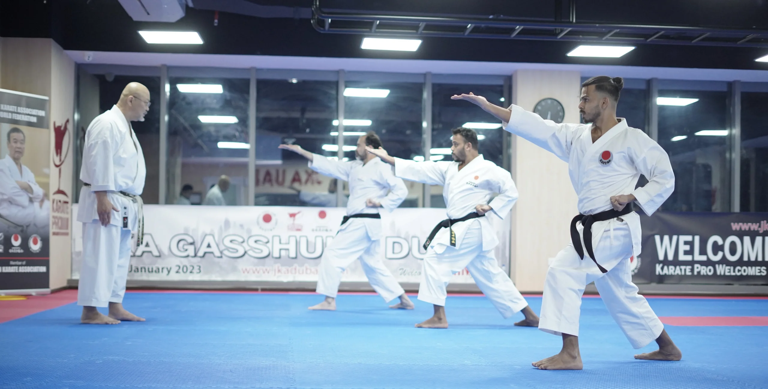 Karateka executing a front kick during a JKA Gasshuku Dubai seminar