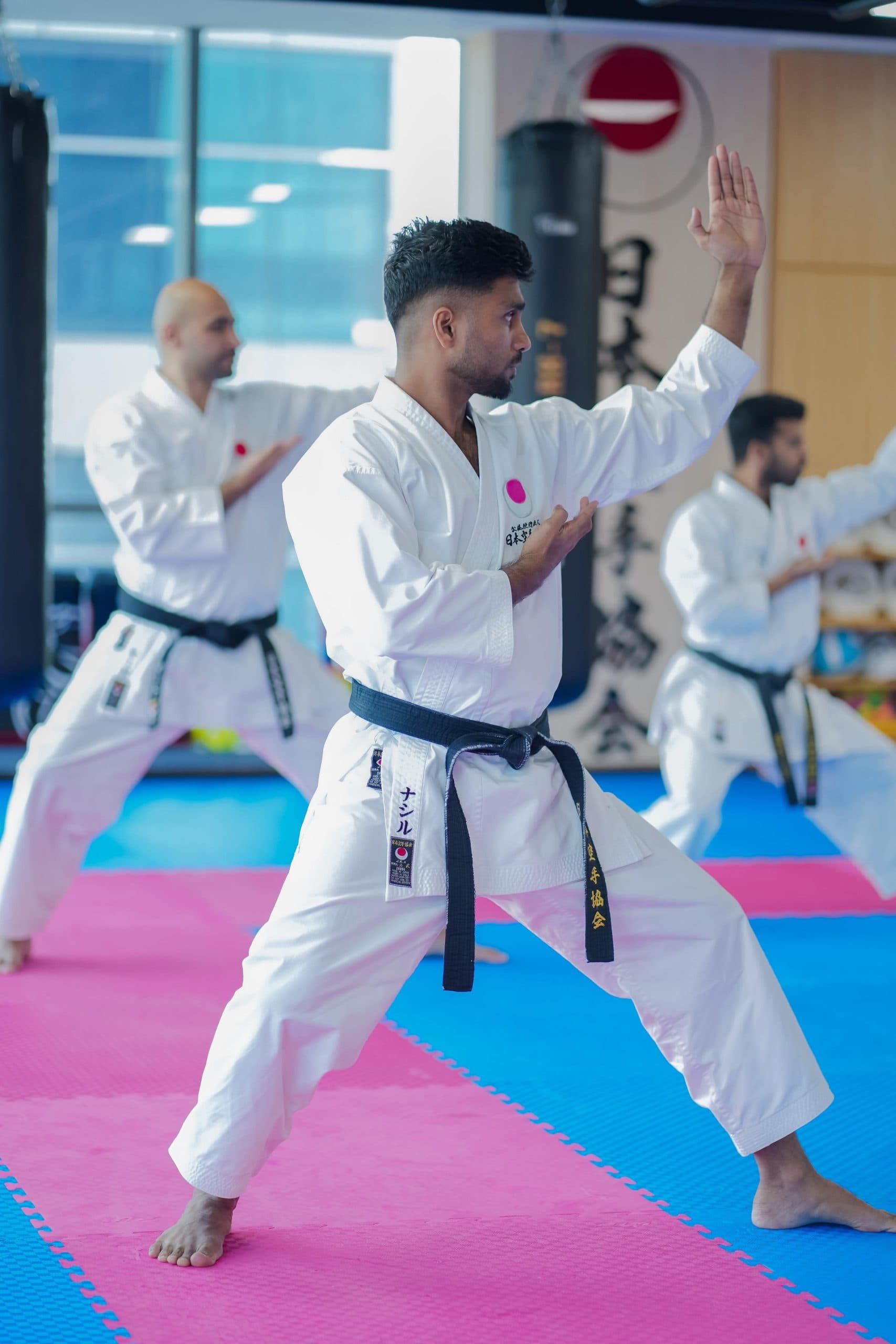 Adult black belt performing a kata technique