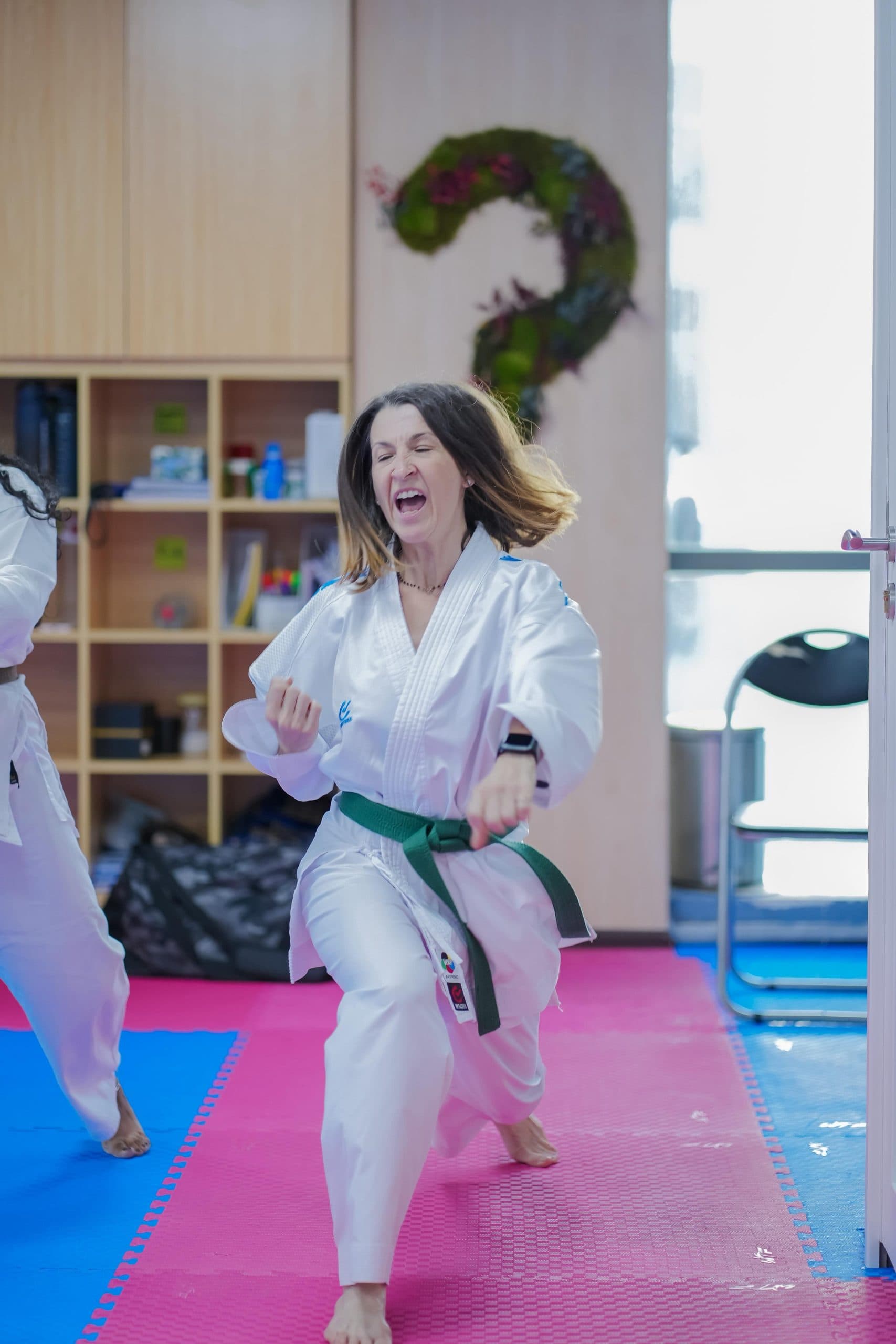 Adult student performing a karate technique during class
