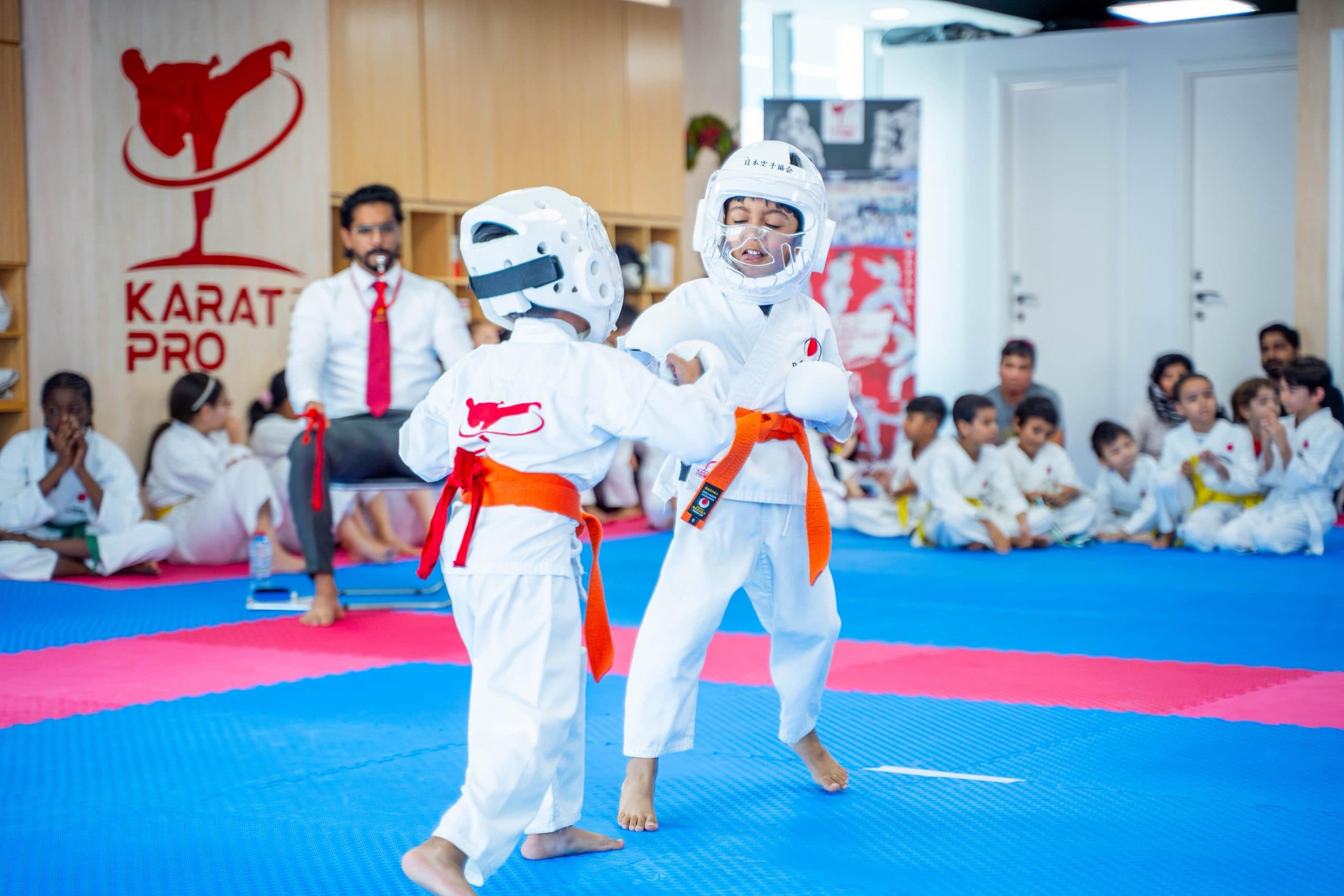 Kids practising sparring technique during a karate class