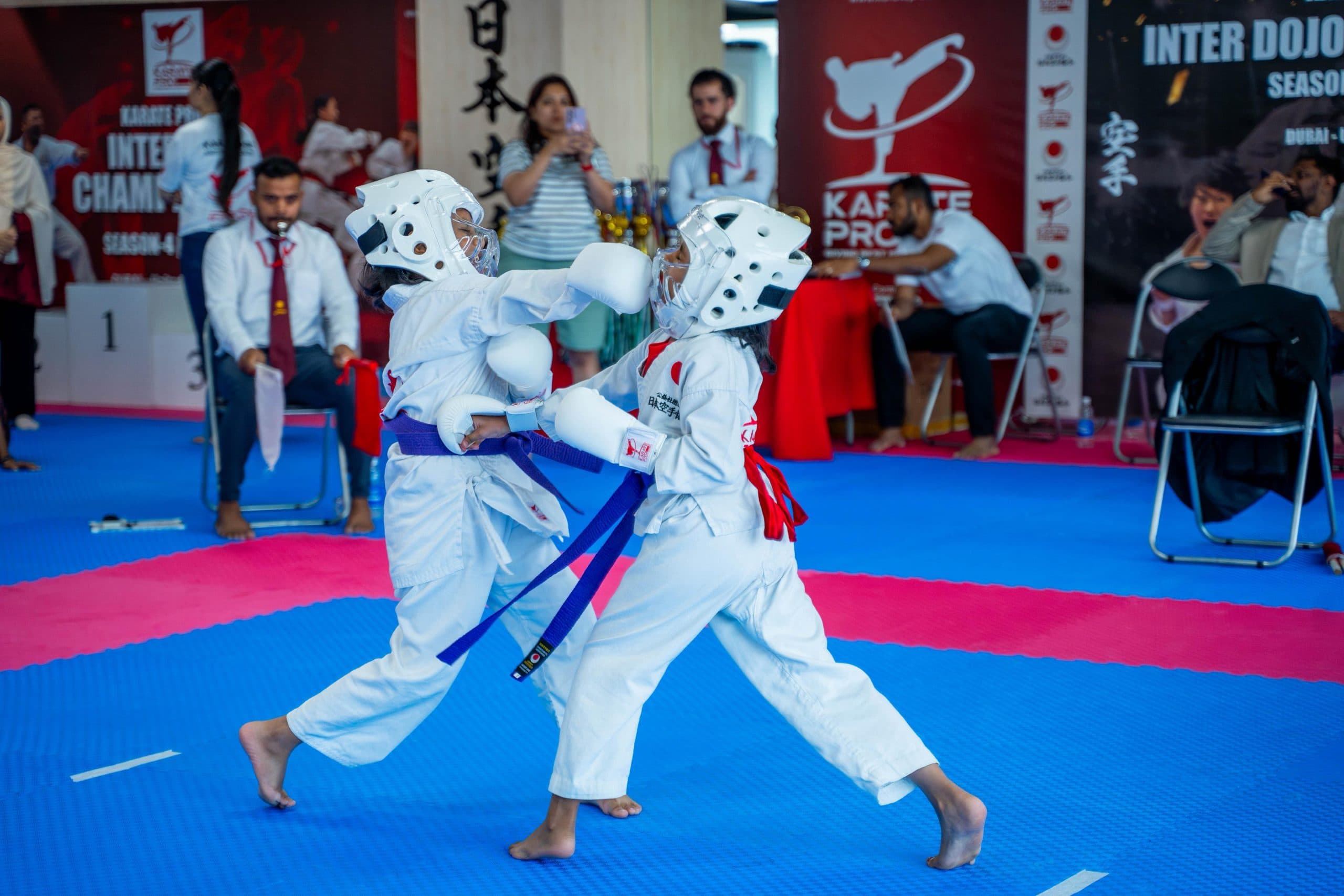 Young students exchanging light sparring during kumite practice