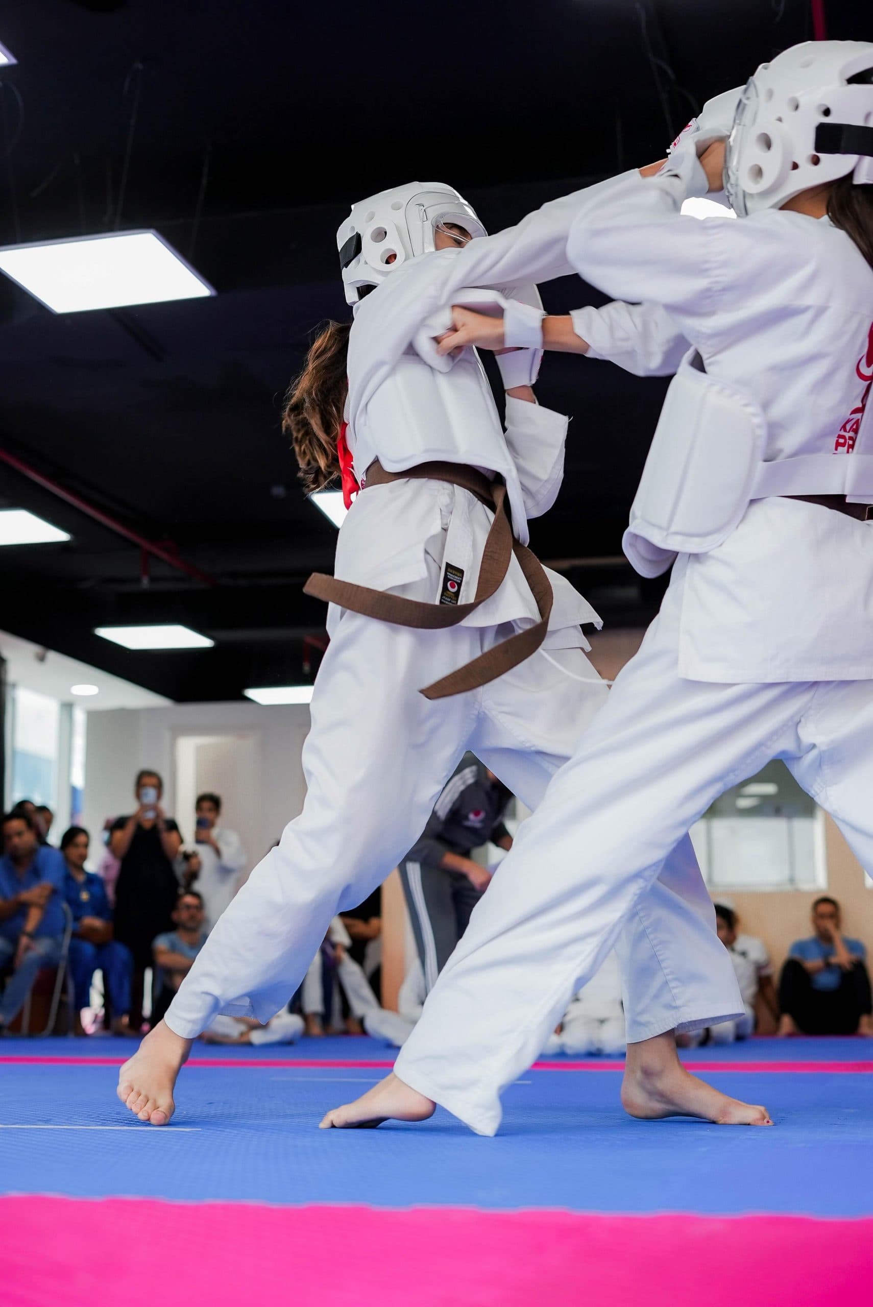 Two students sparring during a kumite drill