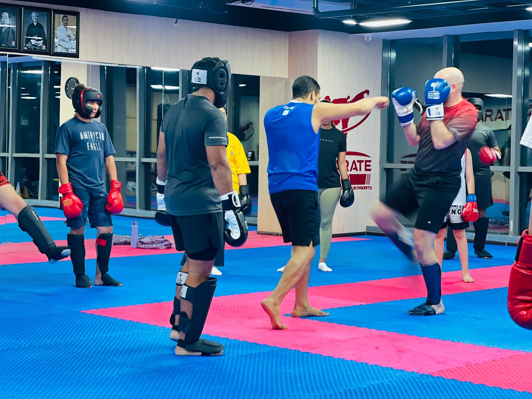 Adults training together during a kickboxing class