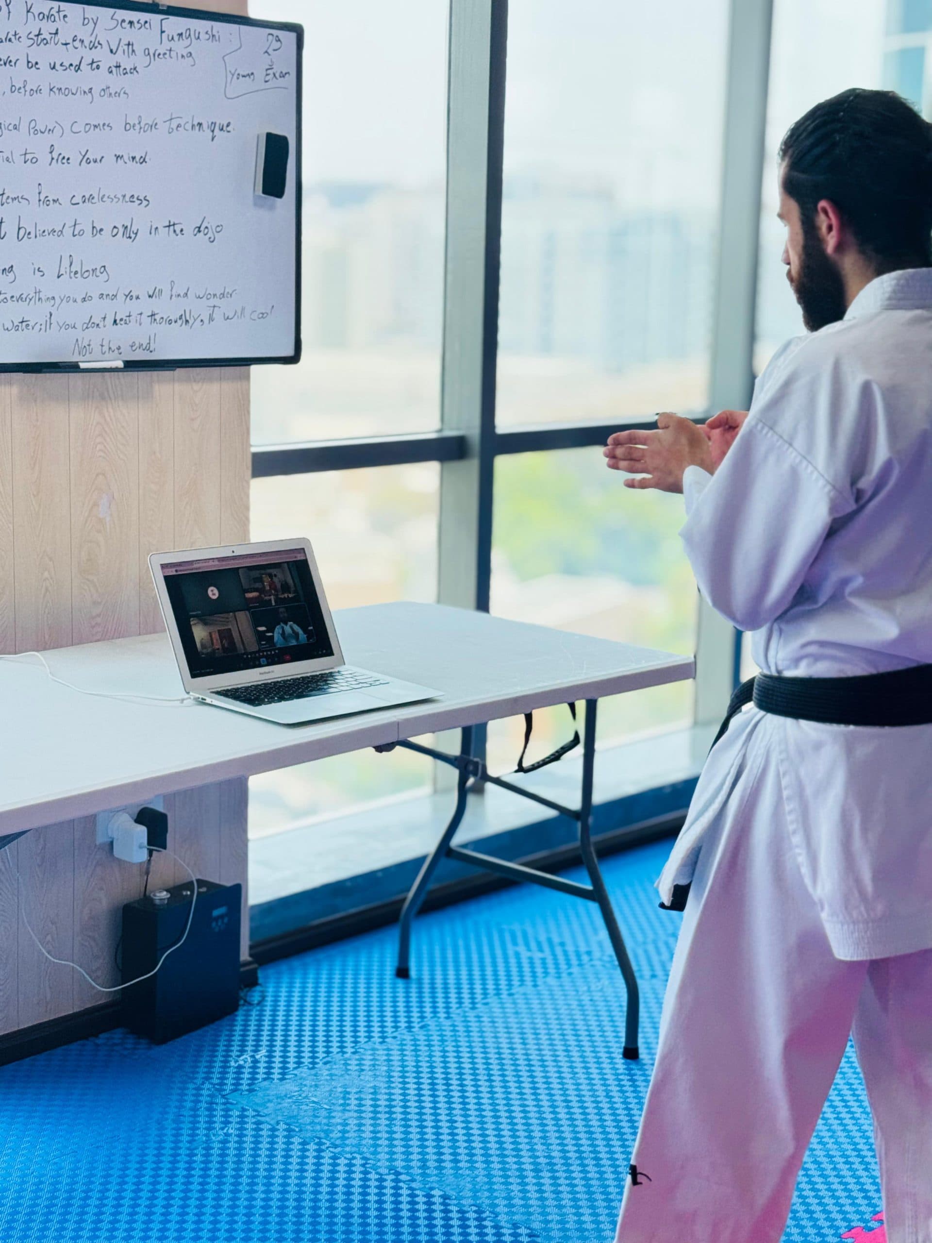 Instructor leading a karate class over a live video call