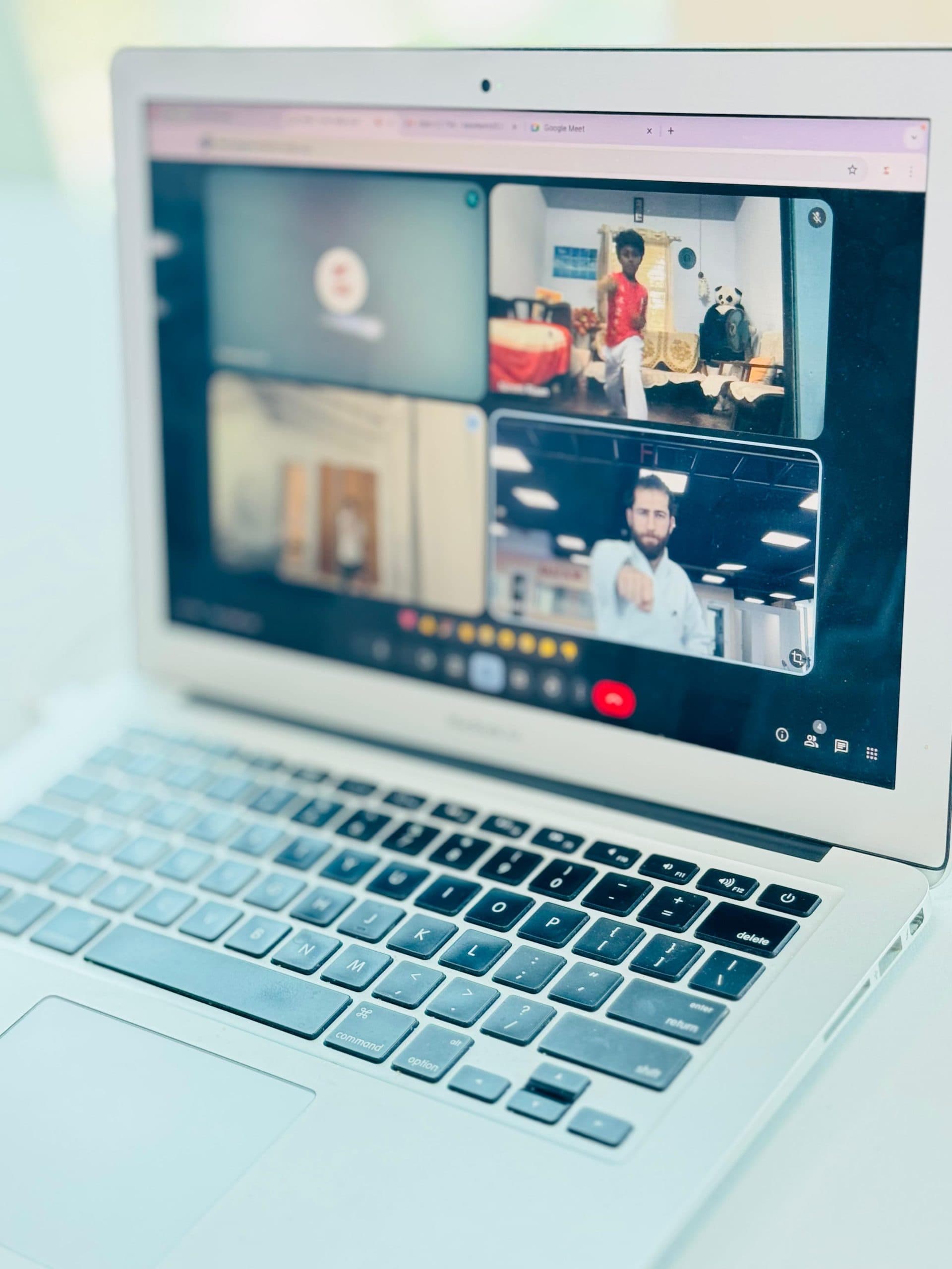 Laptop screen showing students joining an online karate class