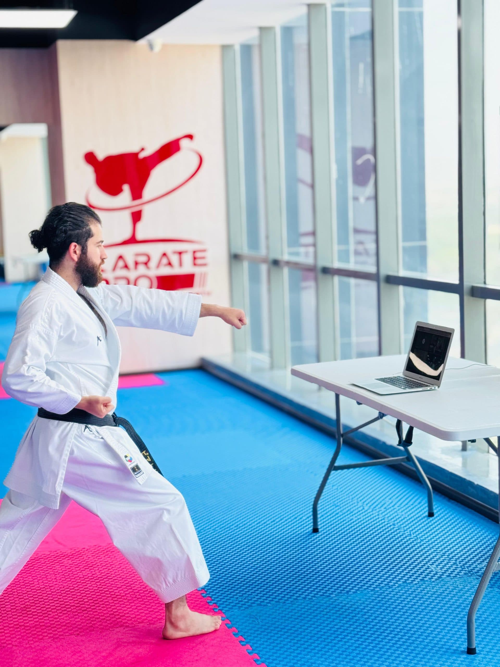 Student practising kata at home during an online karate class